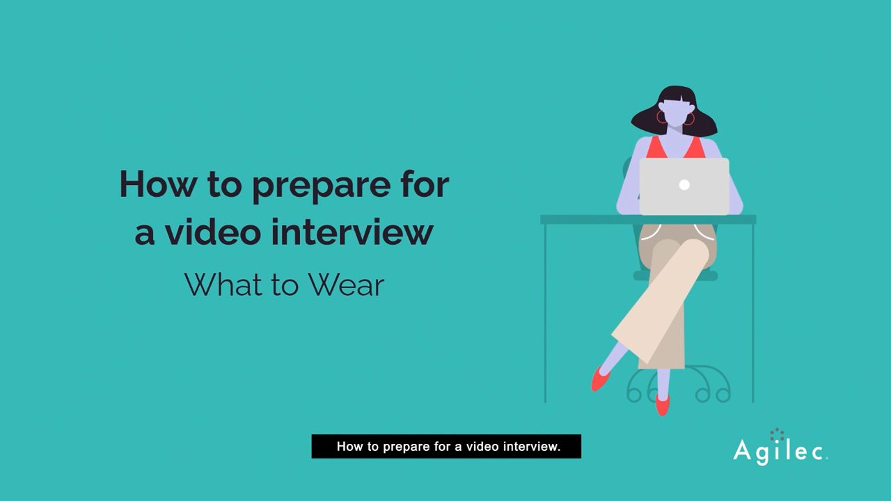 How to Prepare for a Video Interview - What to Wear in large text next to a woman dressed professionally in front of their laptop